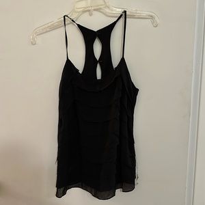 Black ruffle layer tank. In good condition. Size S.